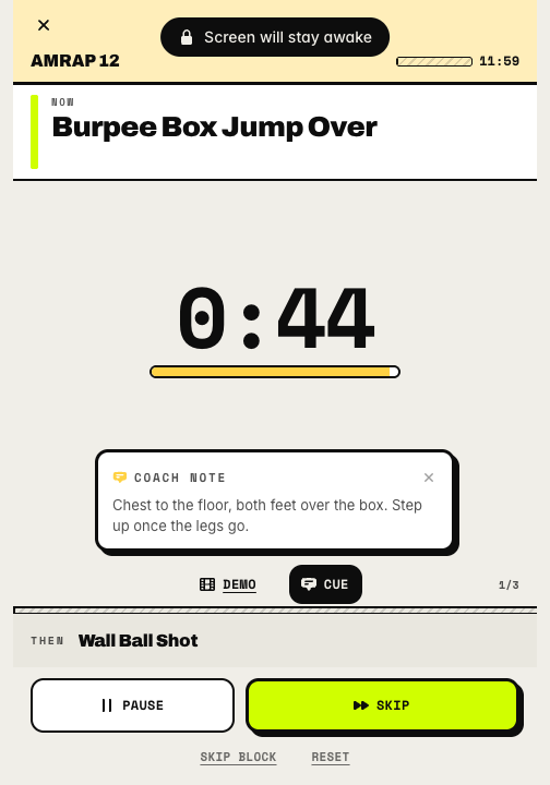 The workout player at the start of a twelve-minute AMRAP, showing a 45-second countdown ring for burpee box jump overs, a coach note, and pause and skip buttons.